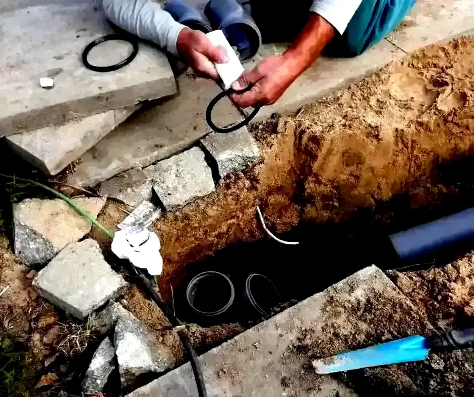 Hands assembling French Drain Installation Boston, MA Hands assembling French Drain Installation Boston, MA